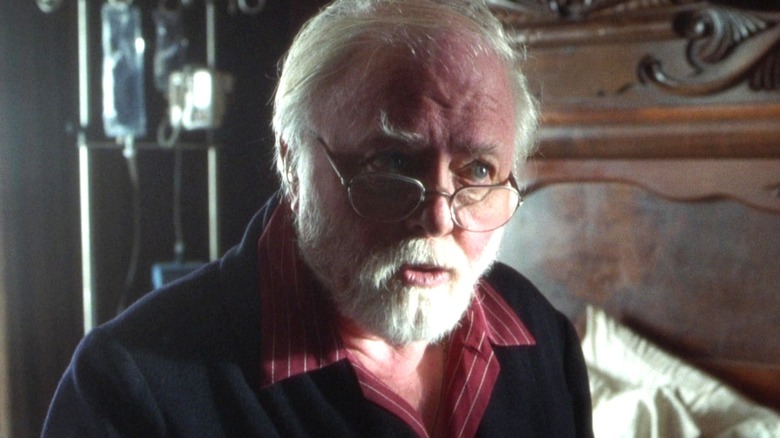 John Hammond sitting on his bed in The Lost World: Jurassic Park