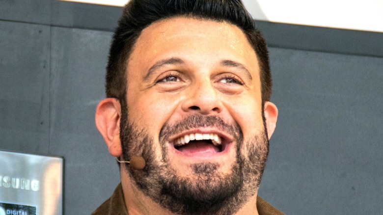 Adam Richman talking Into headset