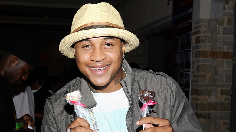 Orlando Brown smiling holding cakepops