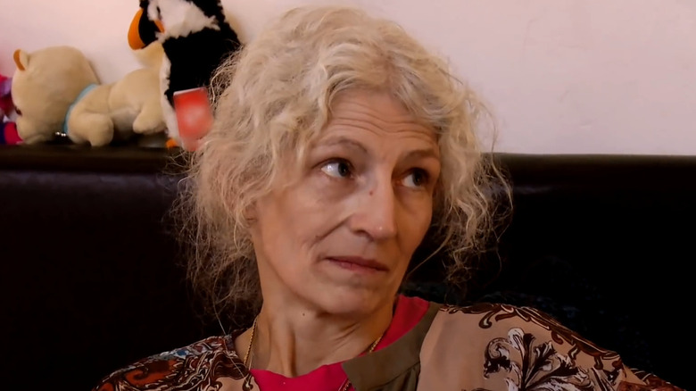 Ami Brown looks up at someone in "Alaskan Bush People" (2014-2022)