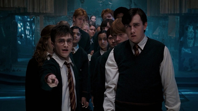 Harry Potter and fellow students wearing school uniforms