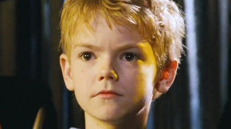 Thomas Brodie-Sangster looks stoic as Sam in Love Actually