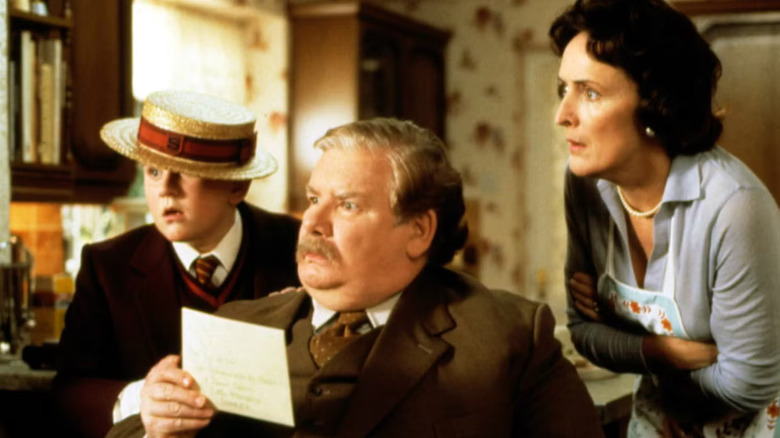 Dudley Vernon and Petunia looking shocked in Harry Potter and the Sorcerer's Stone