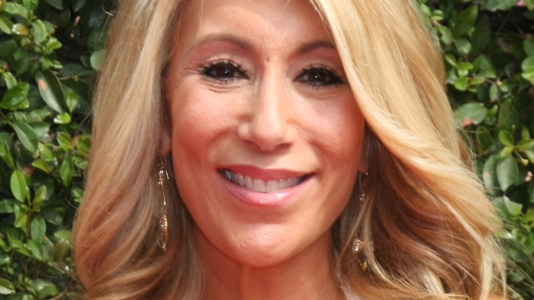 Lori Greiner Face Leafy Background