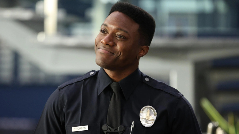 Aaron Thorsen in uniform and smiling in "The Rookie"