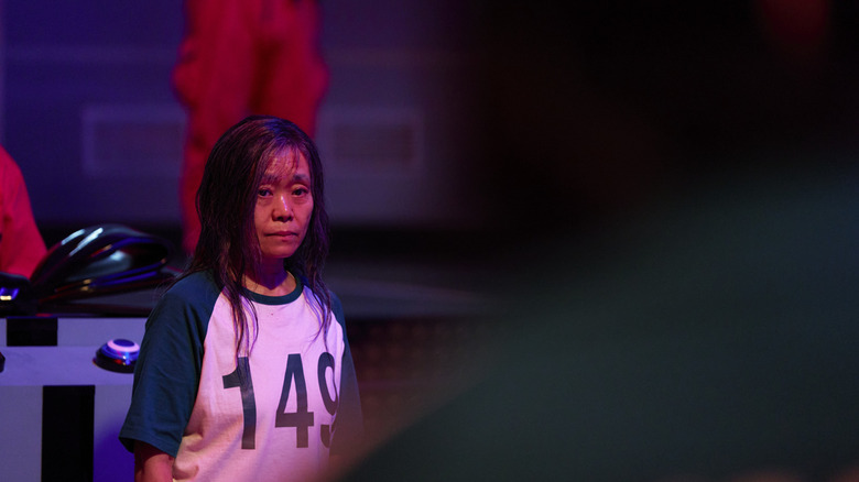 Geum-ja with her hair down looking devastated on Squid Game