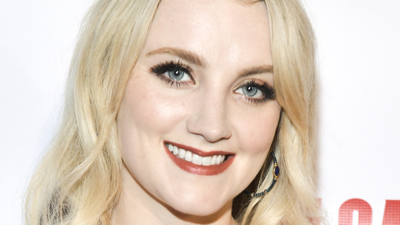 Evanna Lynch smiling at an event