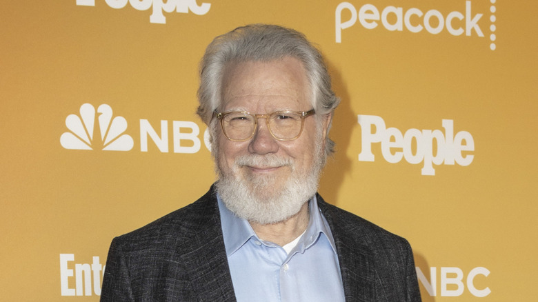 John Larroquette smiling in grey blazer