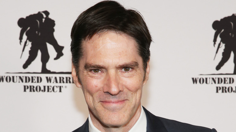 Thomas Gibson smirking