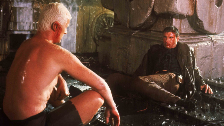 Batty and Deckard sit exhausted on a rooftop