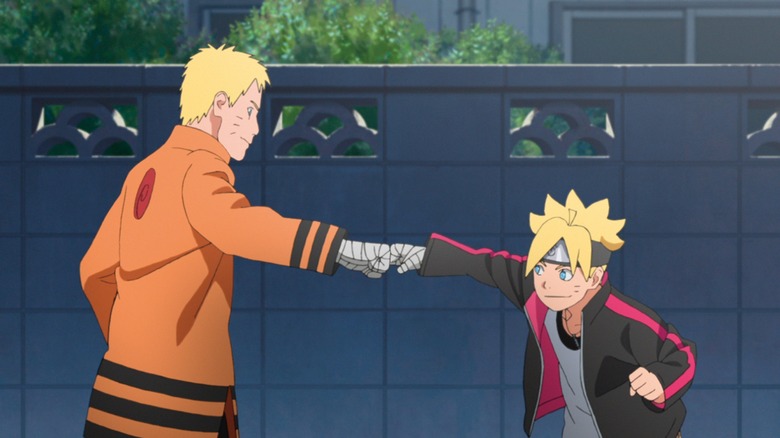 Naruto and Boruto fist-bumping