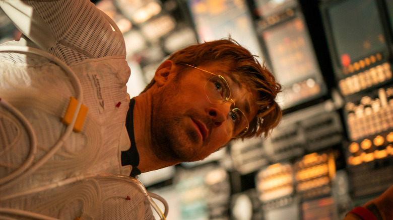 Ryland Grace floats on his vessel in 