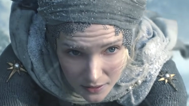 Young Galadriel climbs ice wall 