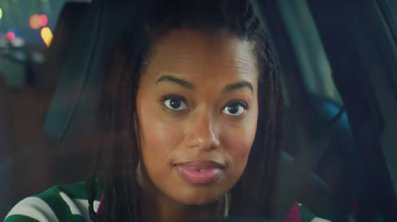Woman looking enthused in a corolla ad