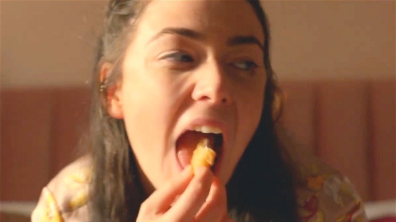Woman eating a nugget