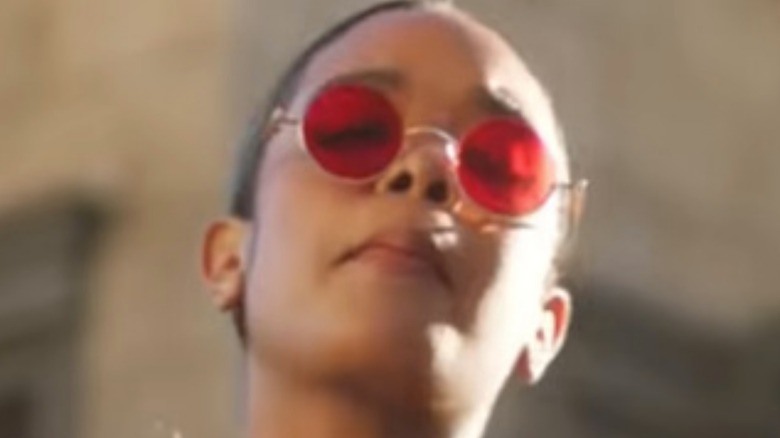 HER wearing red sunglasses