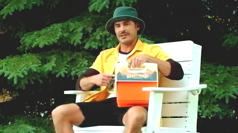 Zac Efron holding an Igloo cooler