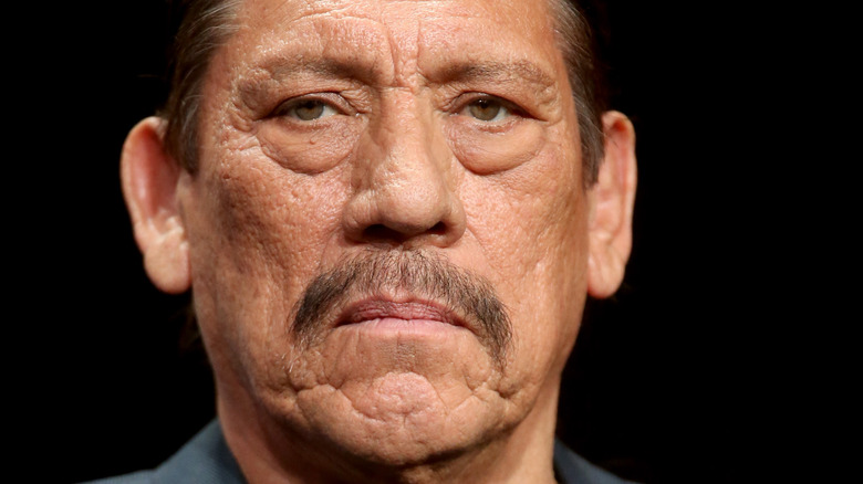 Danny Trejo closeup against black background