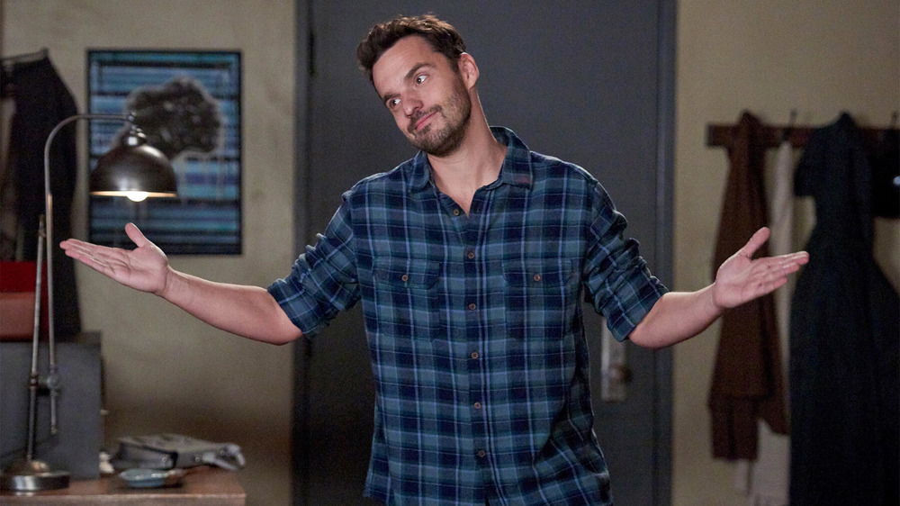 Jake Johnson shrugging New Girl