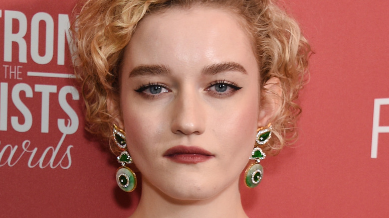 Julia Garner looks into camera