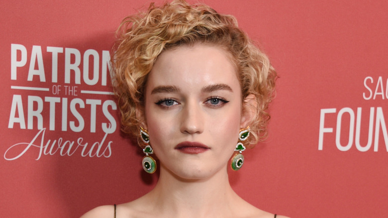 Julia Garner looks into camera