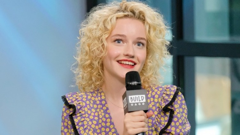 Julia Garner speaking into microphone