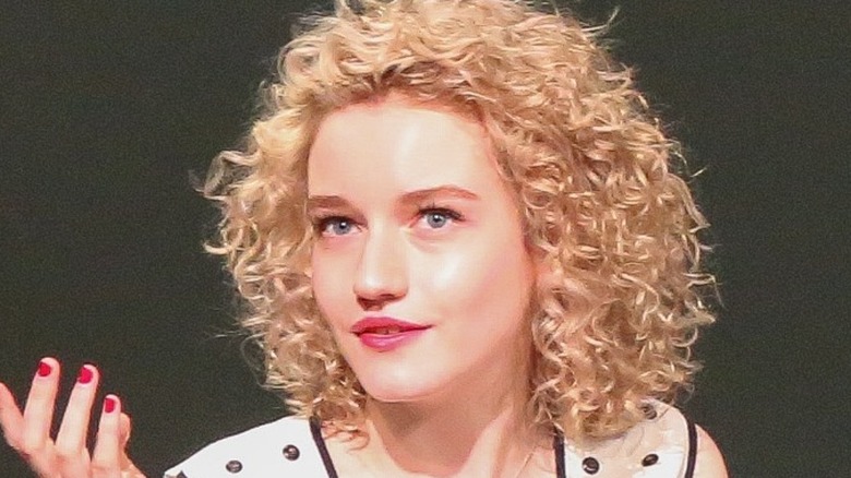 Julia Garner mid-conversation