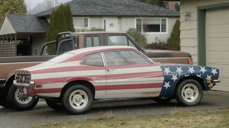 The car of Christopher Smith (aka Peacemaker) (John Cena) outside his dad's house in "Peacemaker"