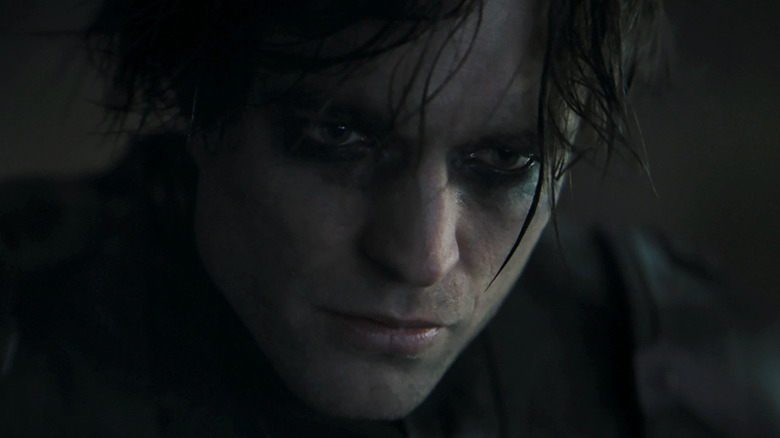Robert Pattinson with smudged black eye makeup