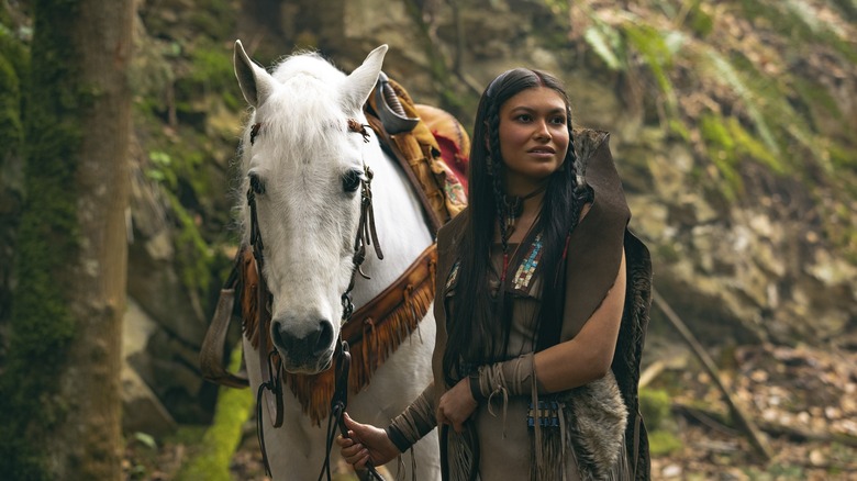 Tiger Lily leads her horse 