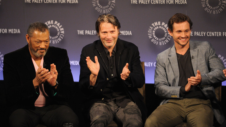 Lawrence Fishburne, Mads Mikkelsen, Hugh Dancy clapping