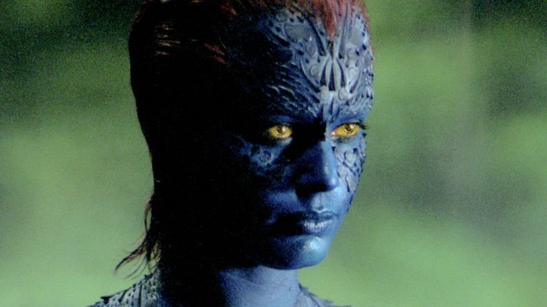 Rebecca Romijn Mystique green background