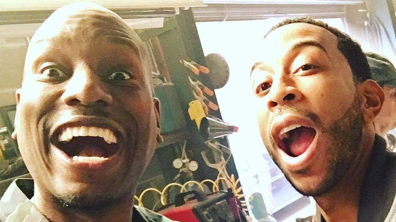 Tyrese Gibson and Ludacris mouths open grinning