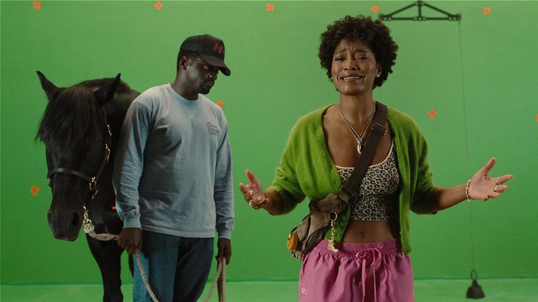 Em talking while OJ handles Lucky on set in Nope