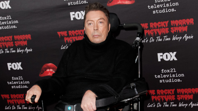 Tim Curry at event in wheelchair