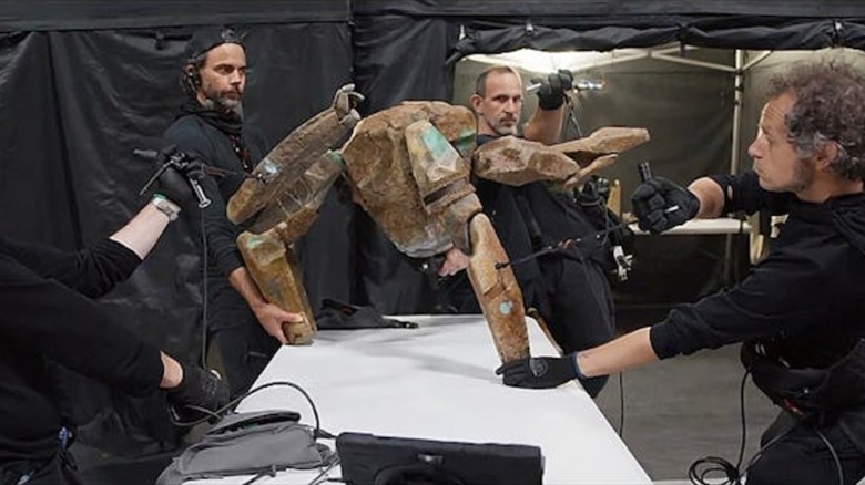 A group of puppeteers working the Rocky puppet in "Project Hail Mary"