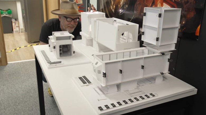 Adam Savage looking at a miniature mockup of the spaceship interior in "Project Hail Mary"
