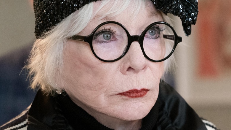 Shirley MacLaine as Leonora Folger looking determined