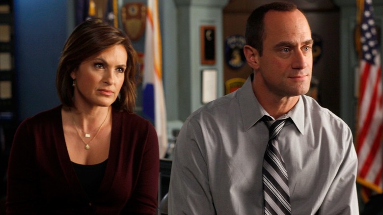 Olivia Benson and Elliot Stabler sitting on desk