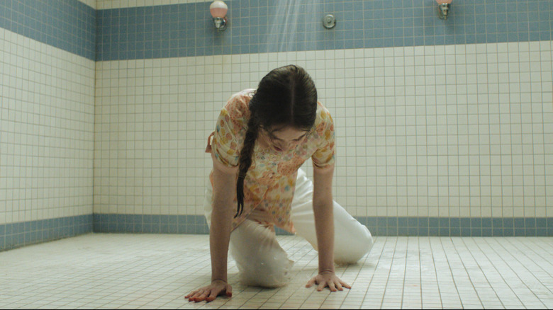 Carrie White in the shower while fully dressed on Carrie