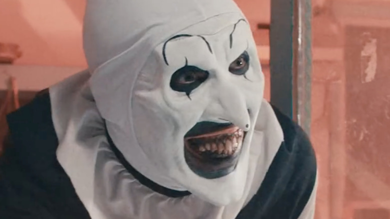 Art the Clown wearing white and black face paint