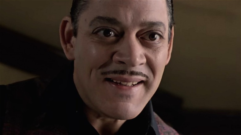 Raul Julia as Gomez smiles in "The Addams Family"