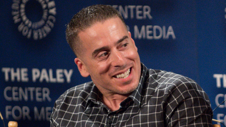Kirk Acevedo turns his head and smiles
