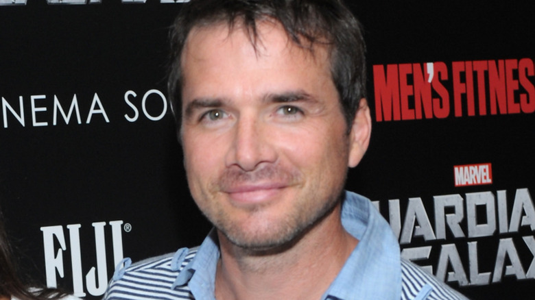 Matthew Settle gives a casual smille