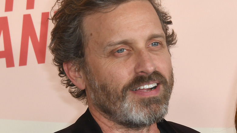 Rob Benedict smiling at event