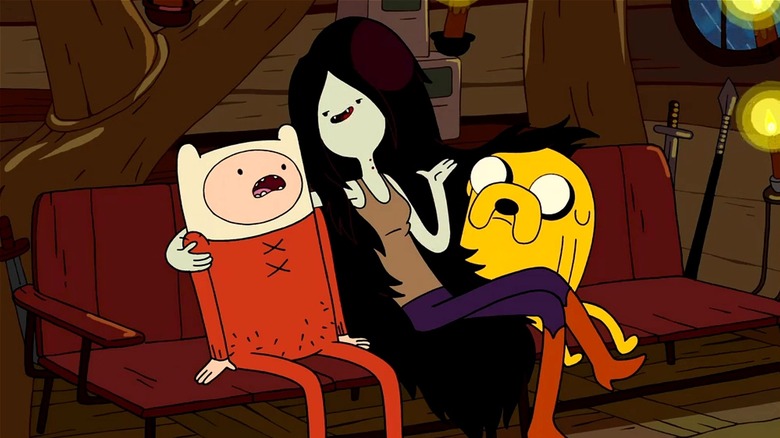 Finn and Jake listening nervously to Marceline while they sit on the couch