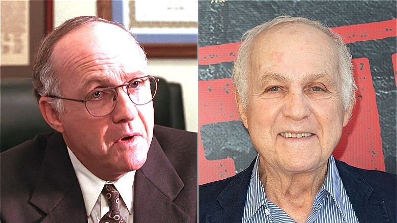 principal sitting in chair/lawrence pressman smiling