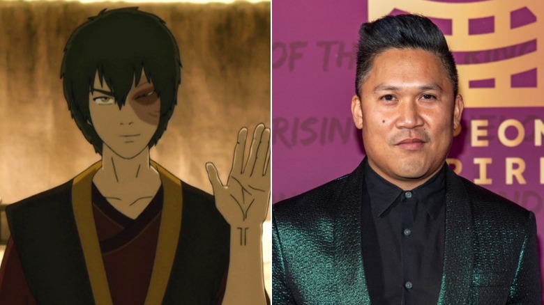 Zuko holding up one hand, and Dante Basco smirking on red carpet