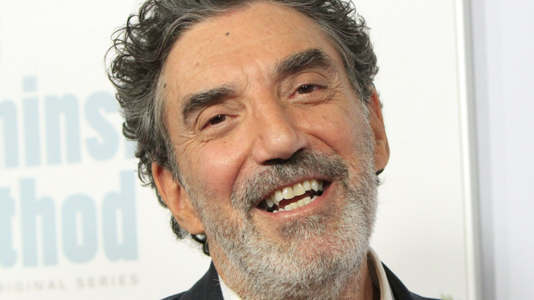 Chuck Lorre cocks head smiles