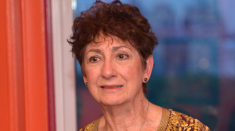 Joanna Merlin in front of window